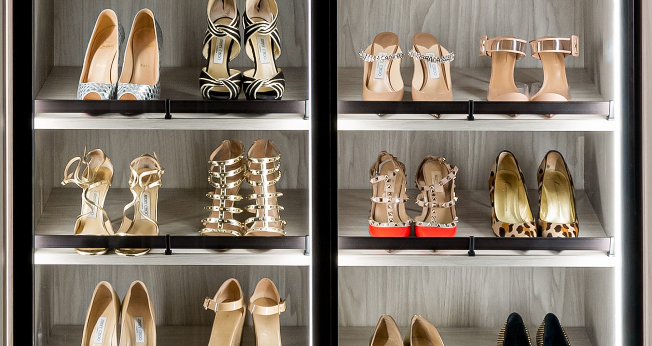 Custom Shoe Cabinet with glass doors and natural wood grain finish by California Closets