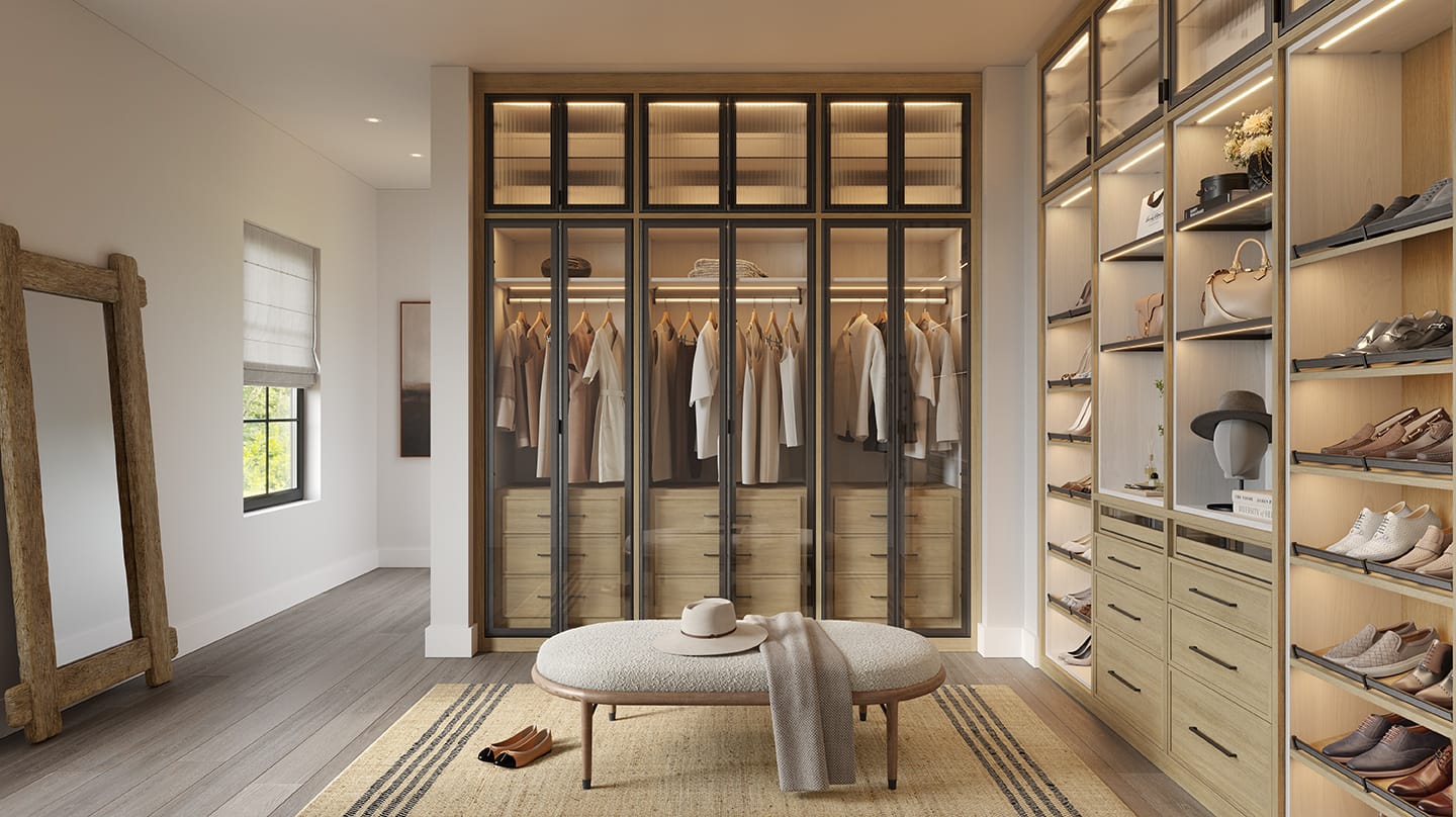 Custom designed light grain wood finish walk-in wardrobe dressing area by California Closets