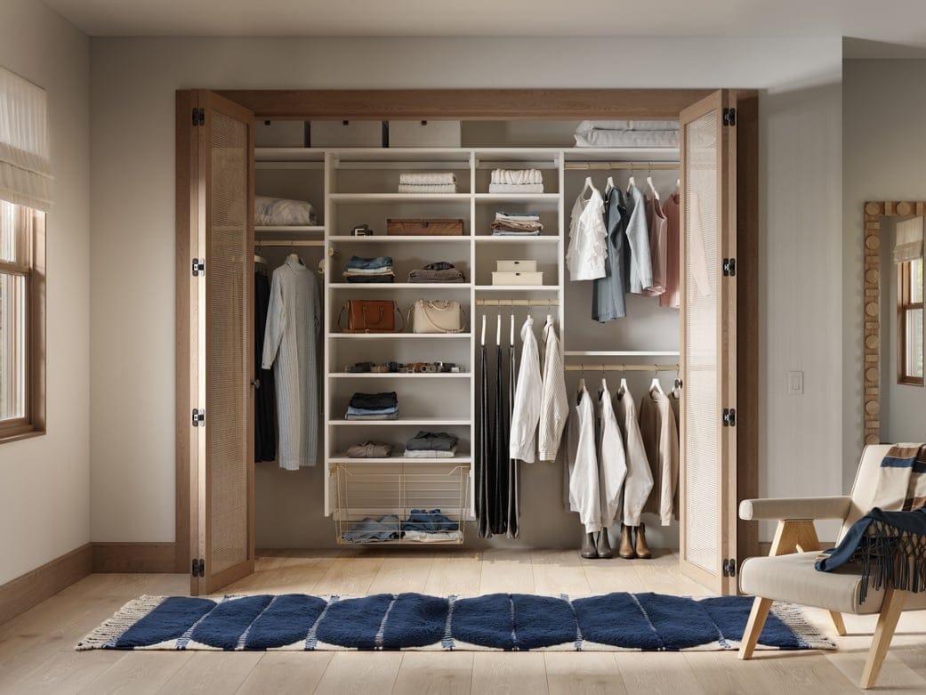 Basic layout closet design with open storage shelves and baskets by California Closets